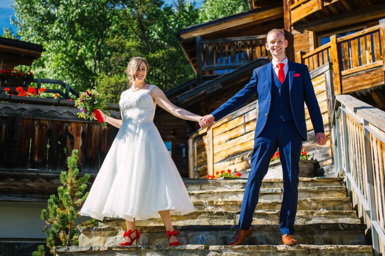Bride & groom hold hands