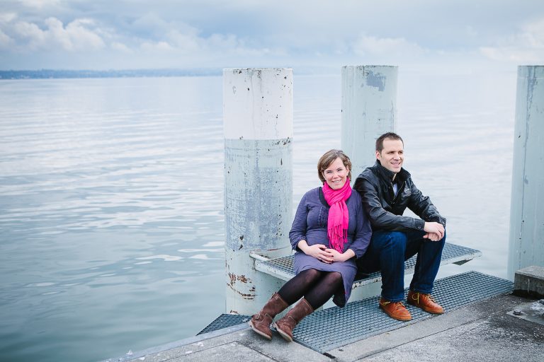 Pregnant couple by lake