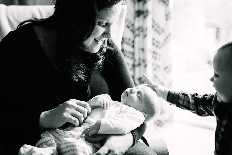 Mum and sibling with newborn baby