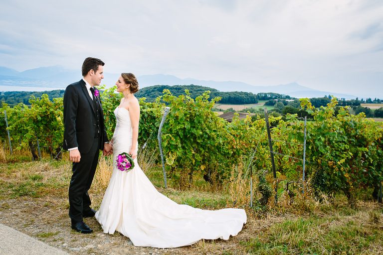 A heartfelt Vineyard wedding Switzerland, blending historic ceremony at Temple de Bursins with joyful portraits in the Vineyard in Yens, surrounded by family, laughter, and timeless romance.